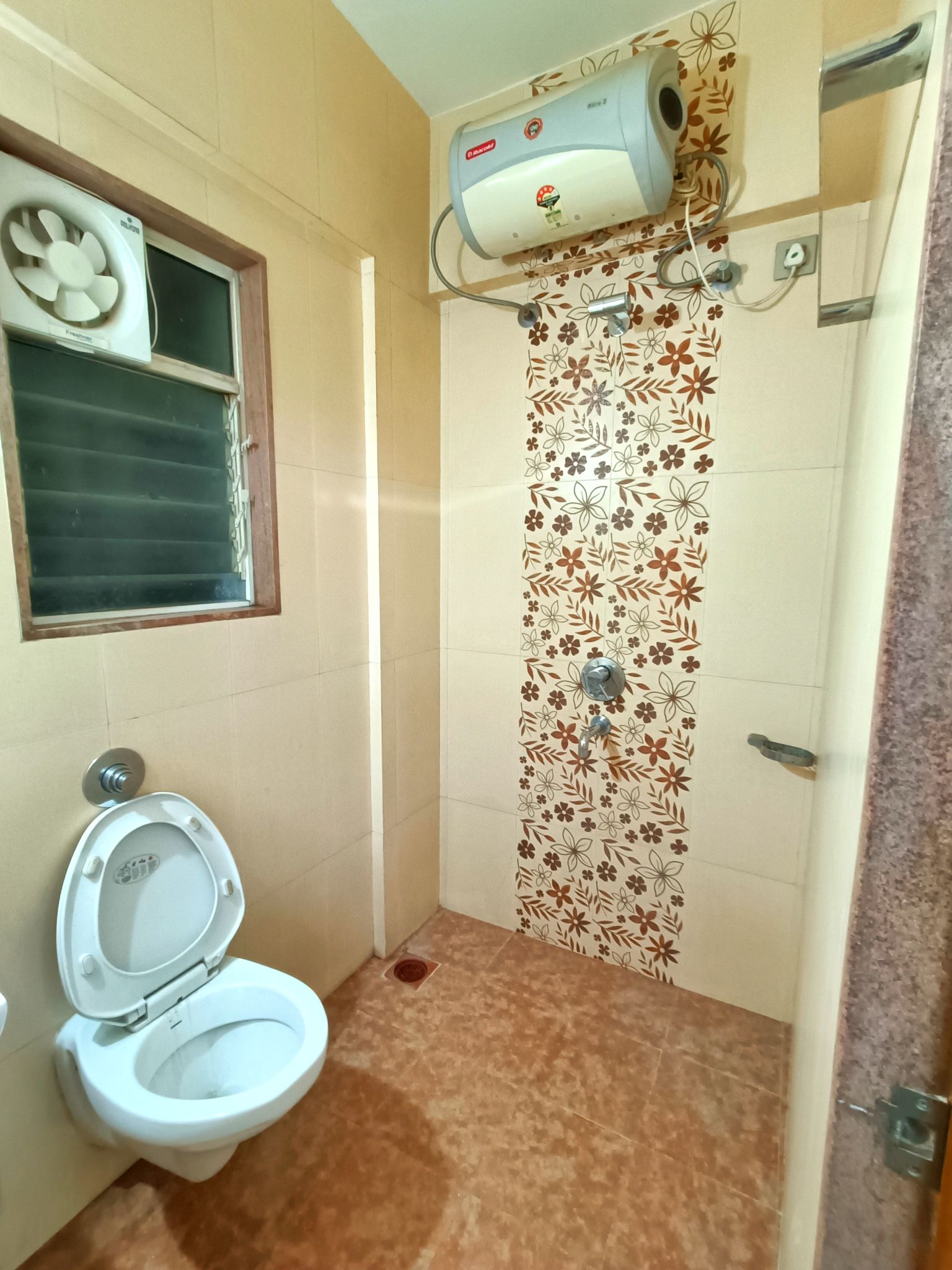 Double sharing room with orange curtains